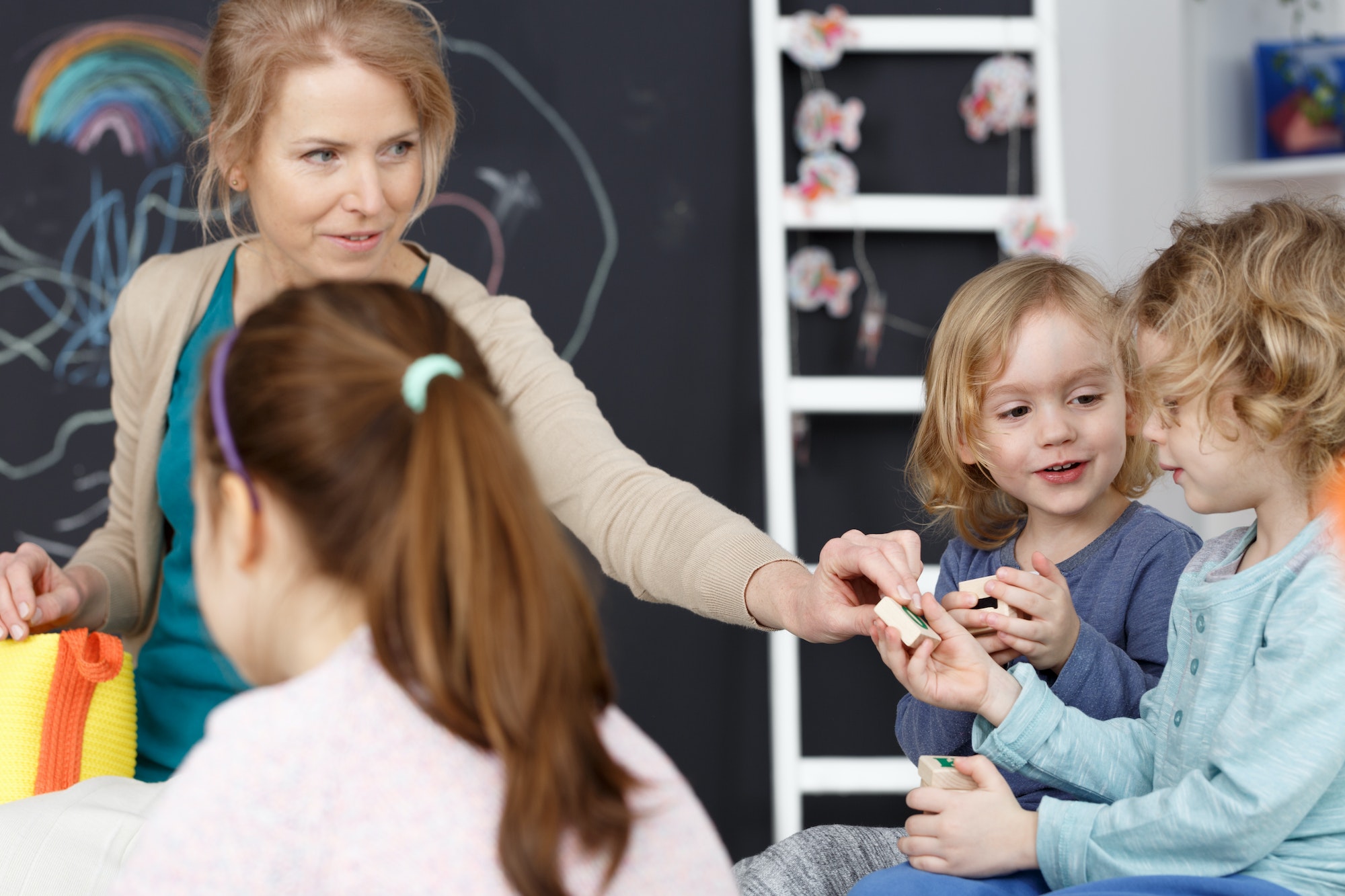 Kindergarten teacher and kids