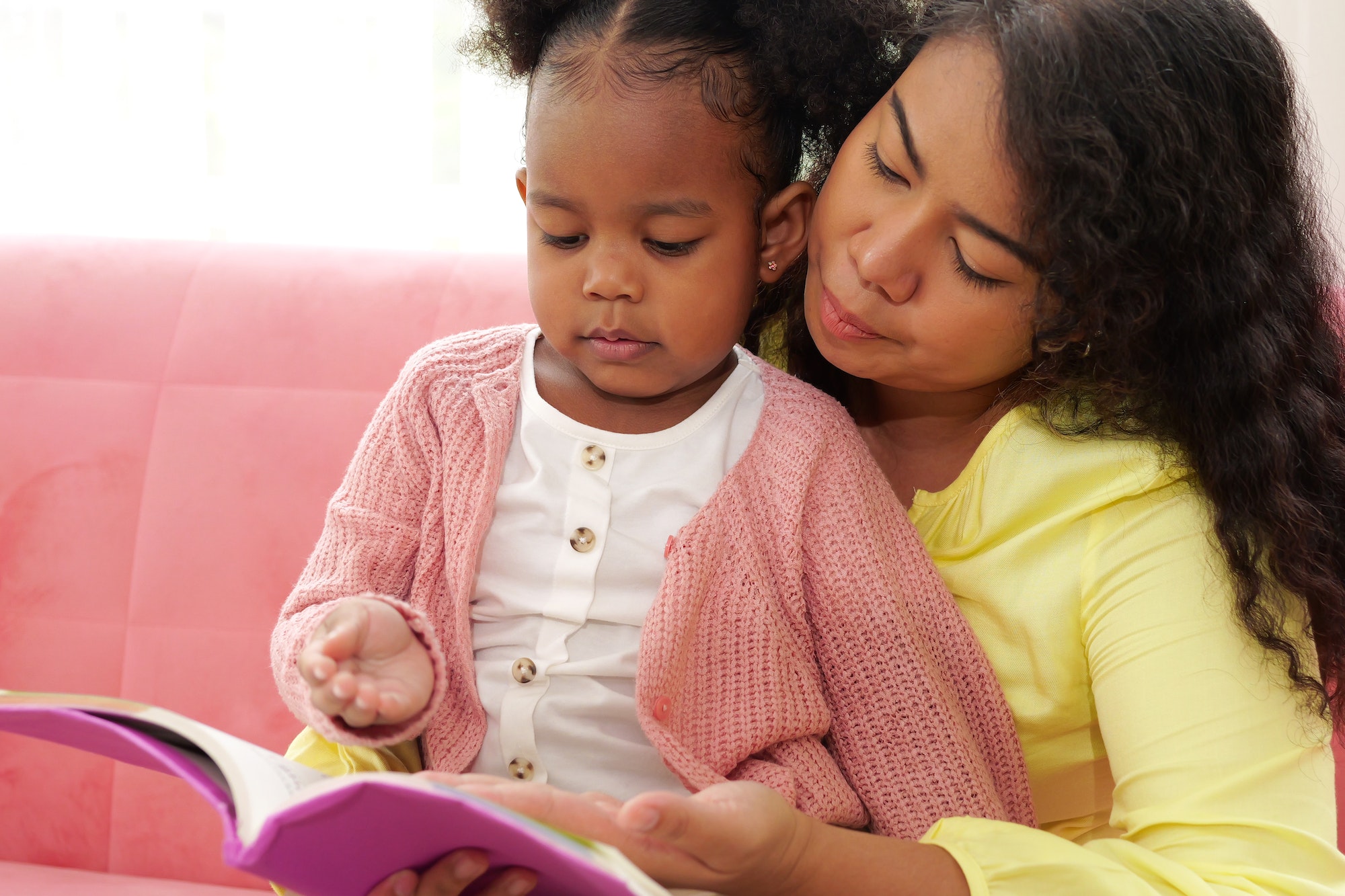 Parent and child having fun with activities and playing at home